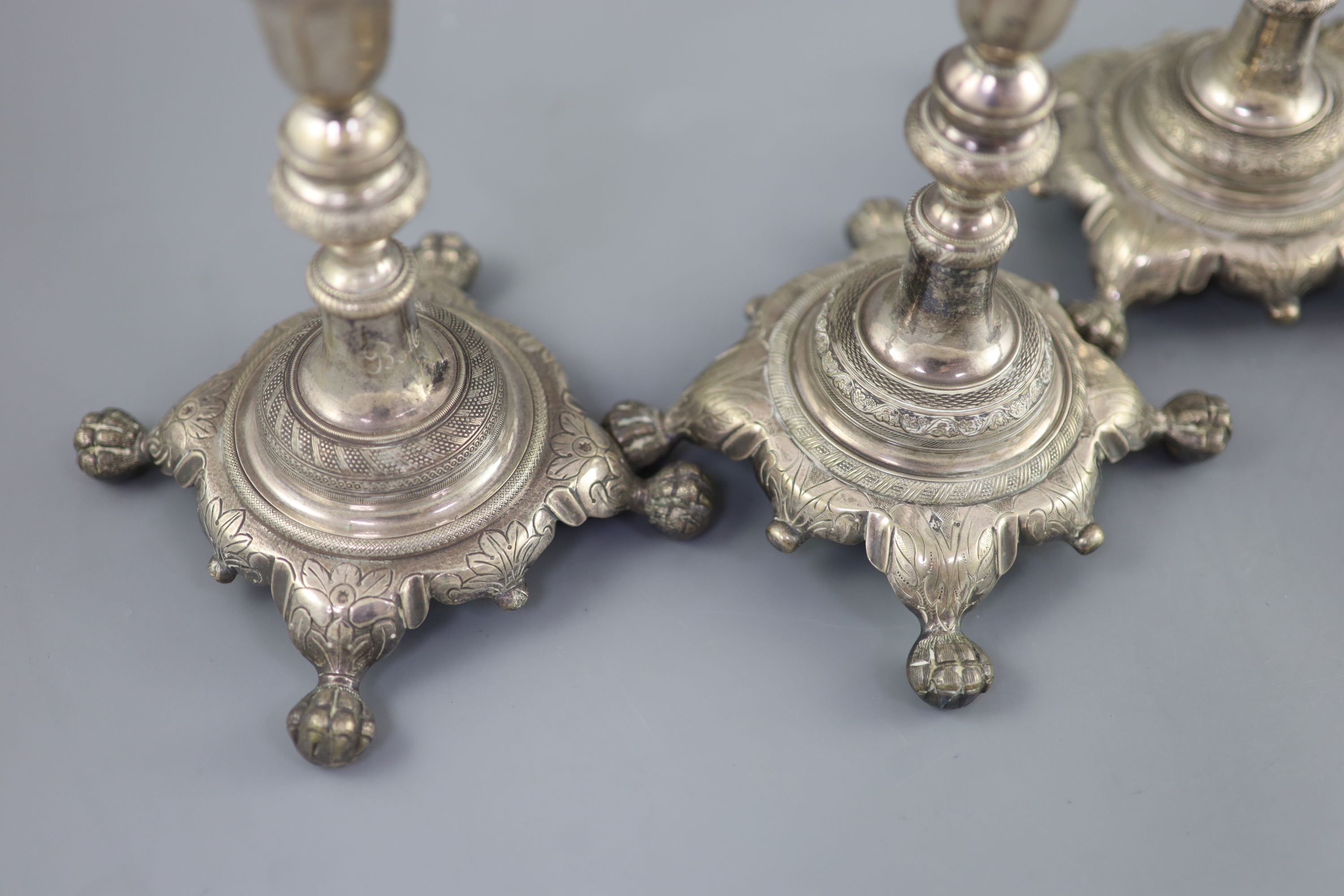 A set of four early 19th century South American? cast silver candlesticks